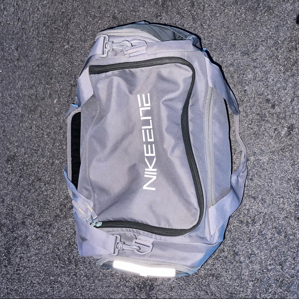 gray and white nike duffel bag